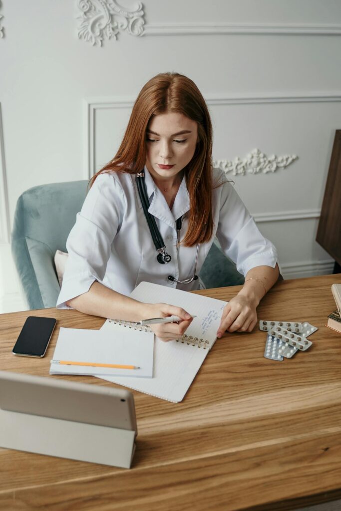 Nigerian medical students in white coats studying medicine