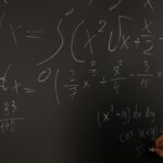 Nigerian student checking NECO result online on laptop